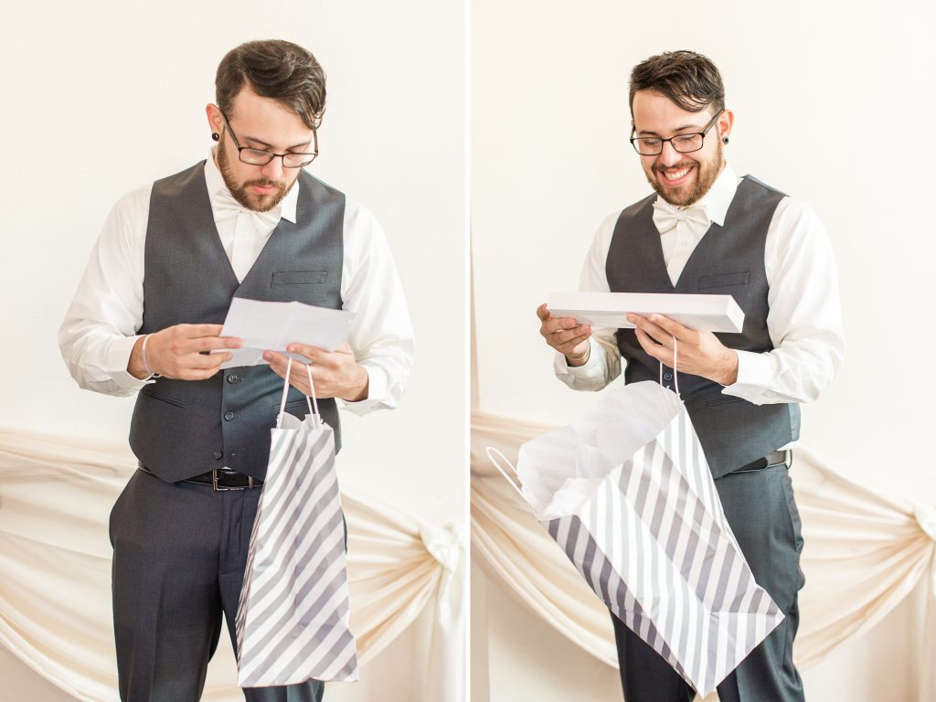 Groom opening gift from bride on wedding day